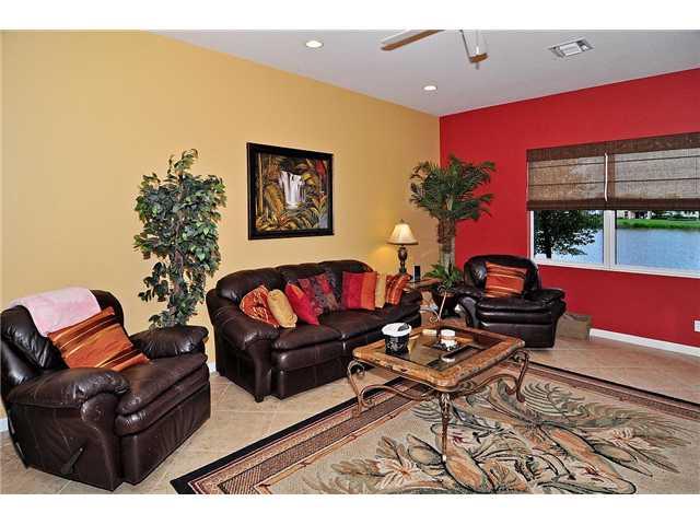 3152 Southwest Porpoise Circle Stuart, FL 34997 - Photo 11 of 19 a living room with furniture and a potted plant