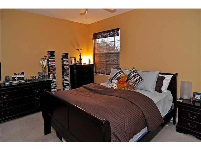 3152 Southwest Porpoise Circle Stuart, FL 34997 - Photo 19 of 19 a bedroom with a bed and a cabinets