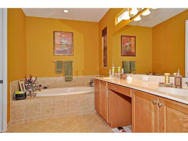 3152 Southwest Porpoise Circle Stuart, FL 34997 - Photo 15 of 19 a bathroom with a sink mirror and a bath tub
