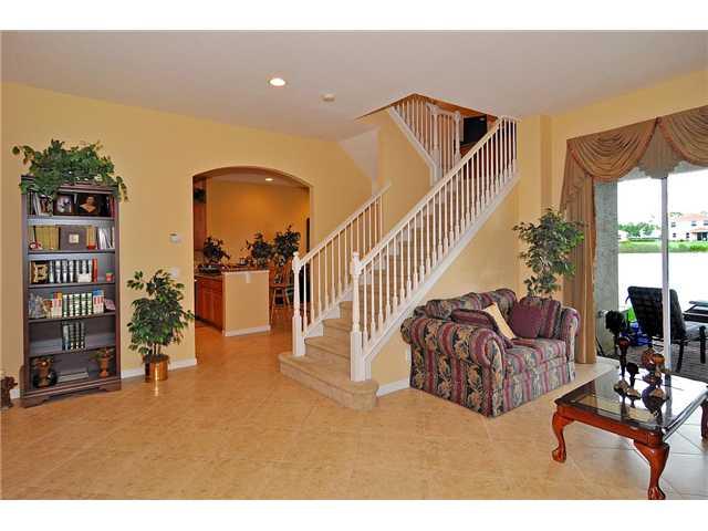 3152 Southwest Porpoise Circle Stuart, FL 34997 - Photo 7 of 19 a living room with furniture and a flat screen tv