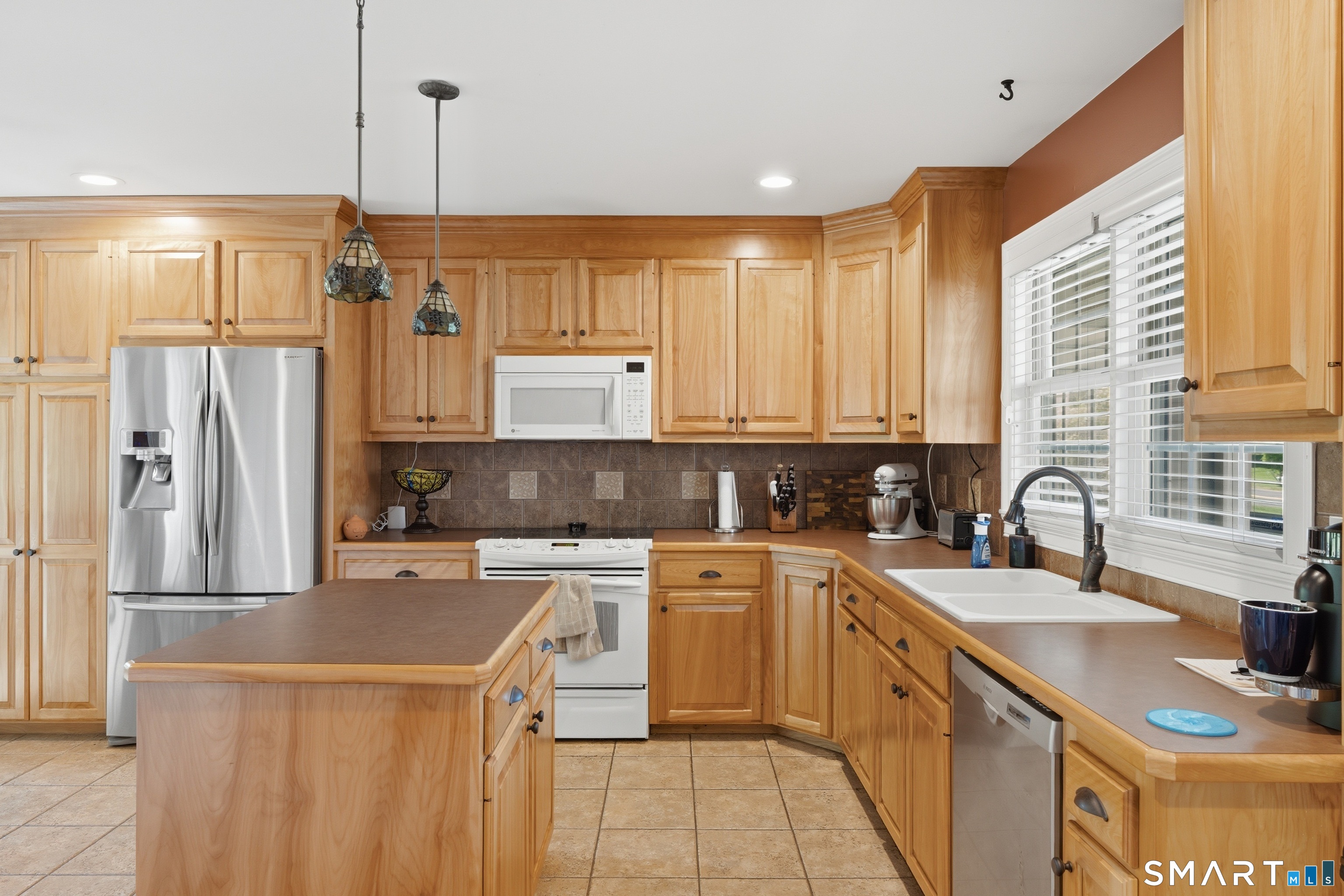 48 Case Road Burlington, CT 06013 - Photo 8 of 39 a kitchen with stainless steel appliances granite countertop a sink a stove and refrigerator
