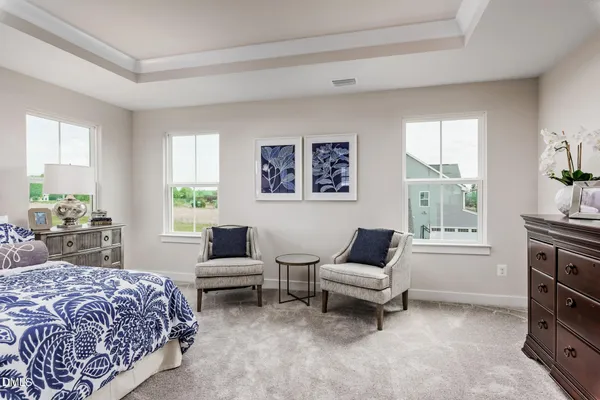 a bedroom with a bed furniture and window