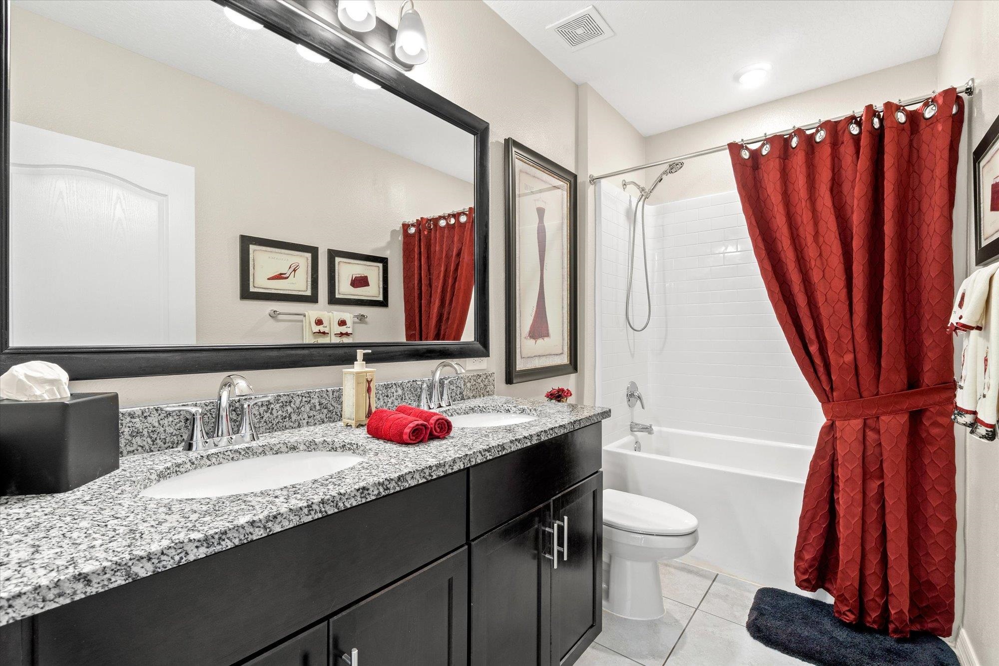 1 Frenora Lane Palm Coast, FL 32137 - Photo 19 of 43 Full bathroom featuring double vanity, shower / bath combo, and light tile patterned floors