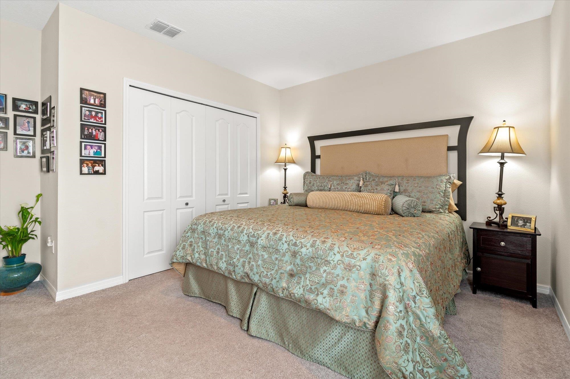 1 Frenora Lane Palm Coast, FL 32137 - Photo 21 of 43 Bedroom featuring a closet and light carpet