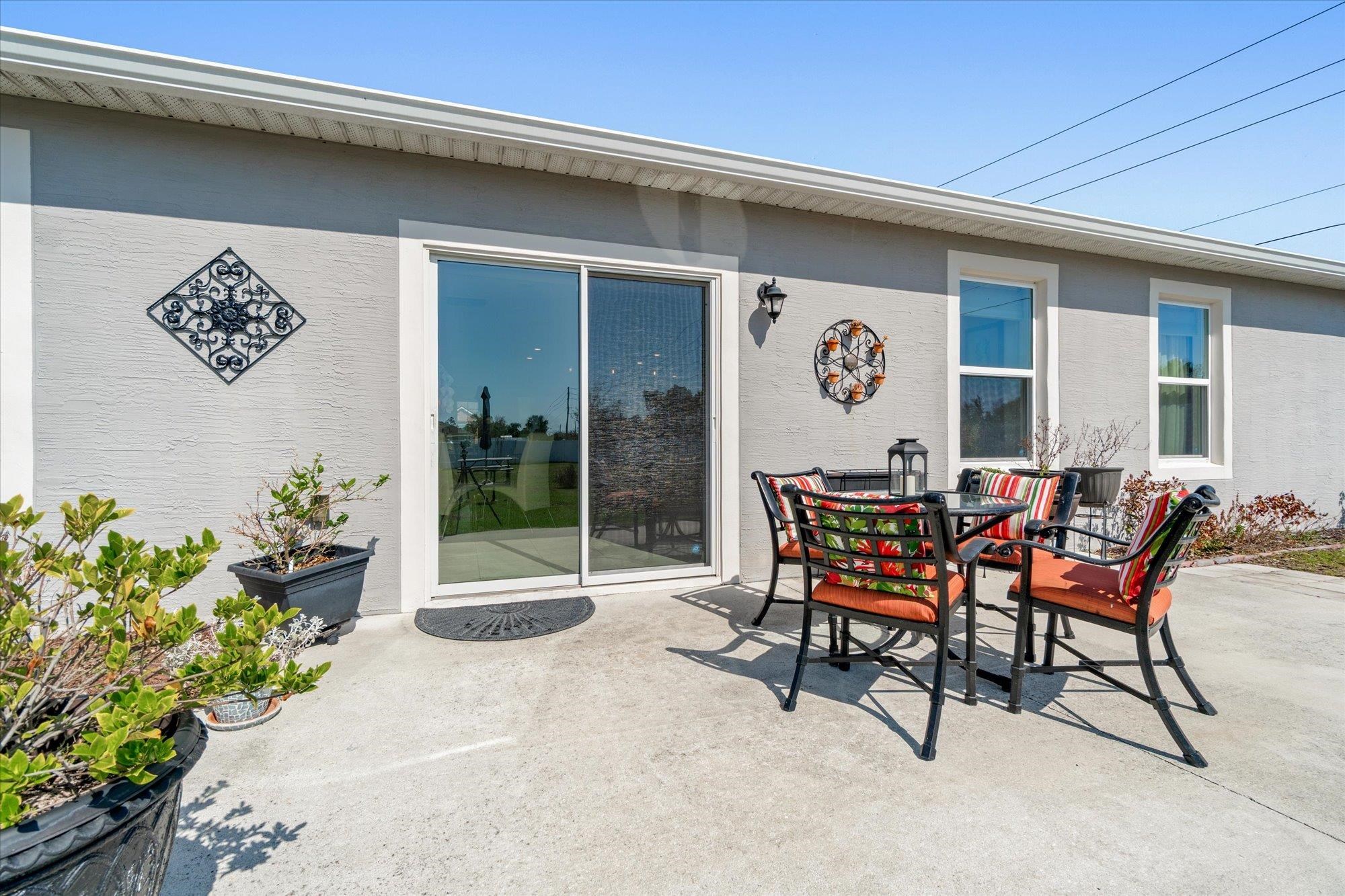 1 Frenora Lane Palm Coast, FL 32137 - Photo 25 of 43 View of patio featuring outdoor dining space