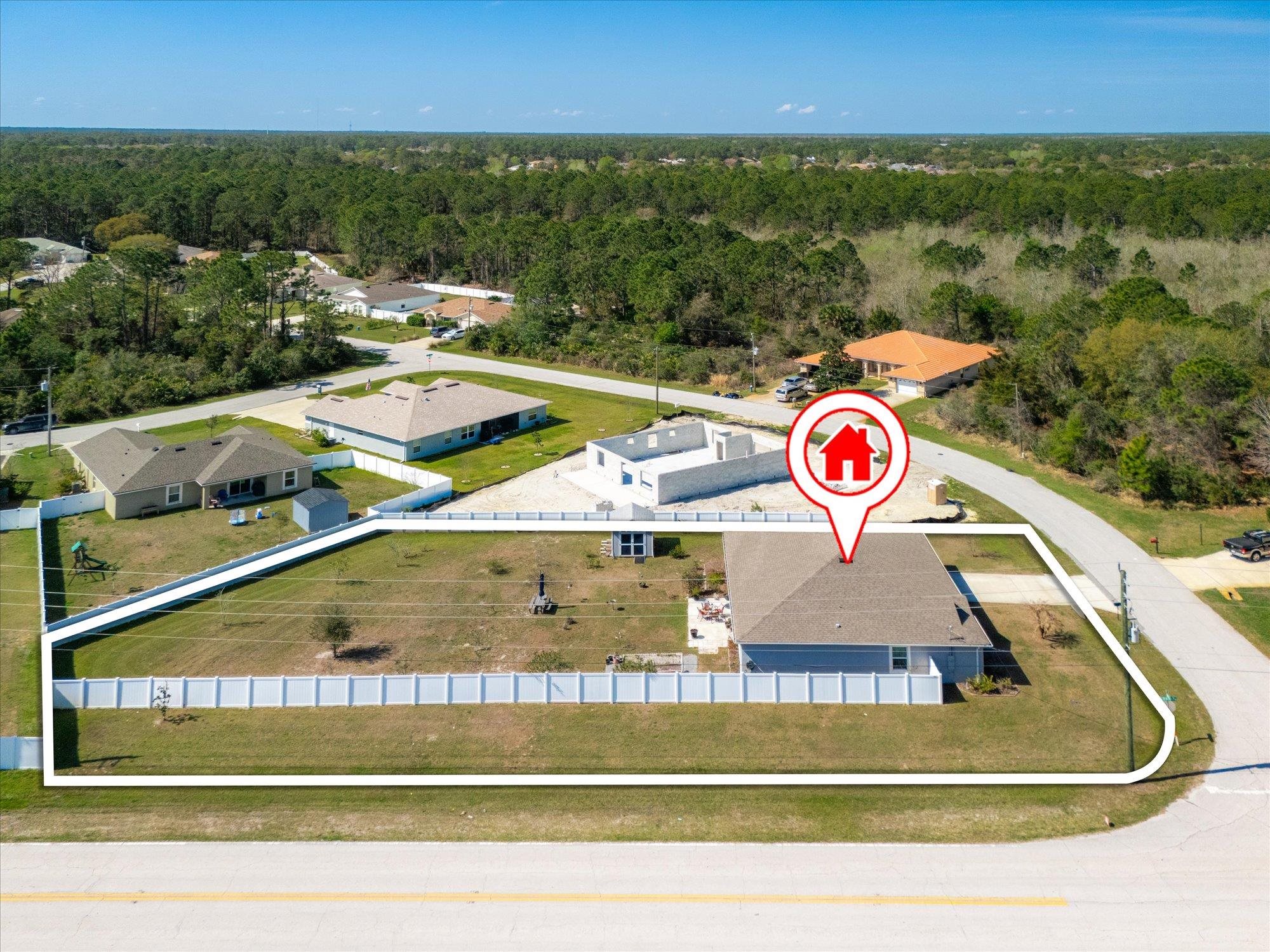 1 Frenora Lane Palm Coast, FL 32137 - Photo 37 of 43 Aerial view of residential area with a heavily wooded area