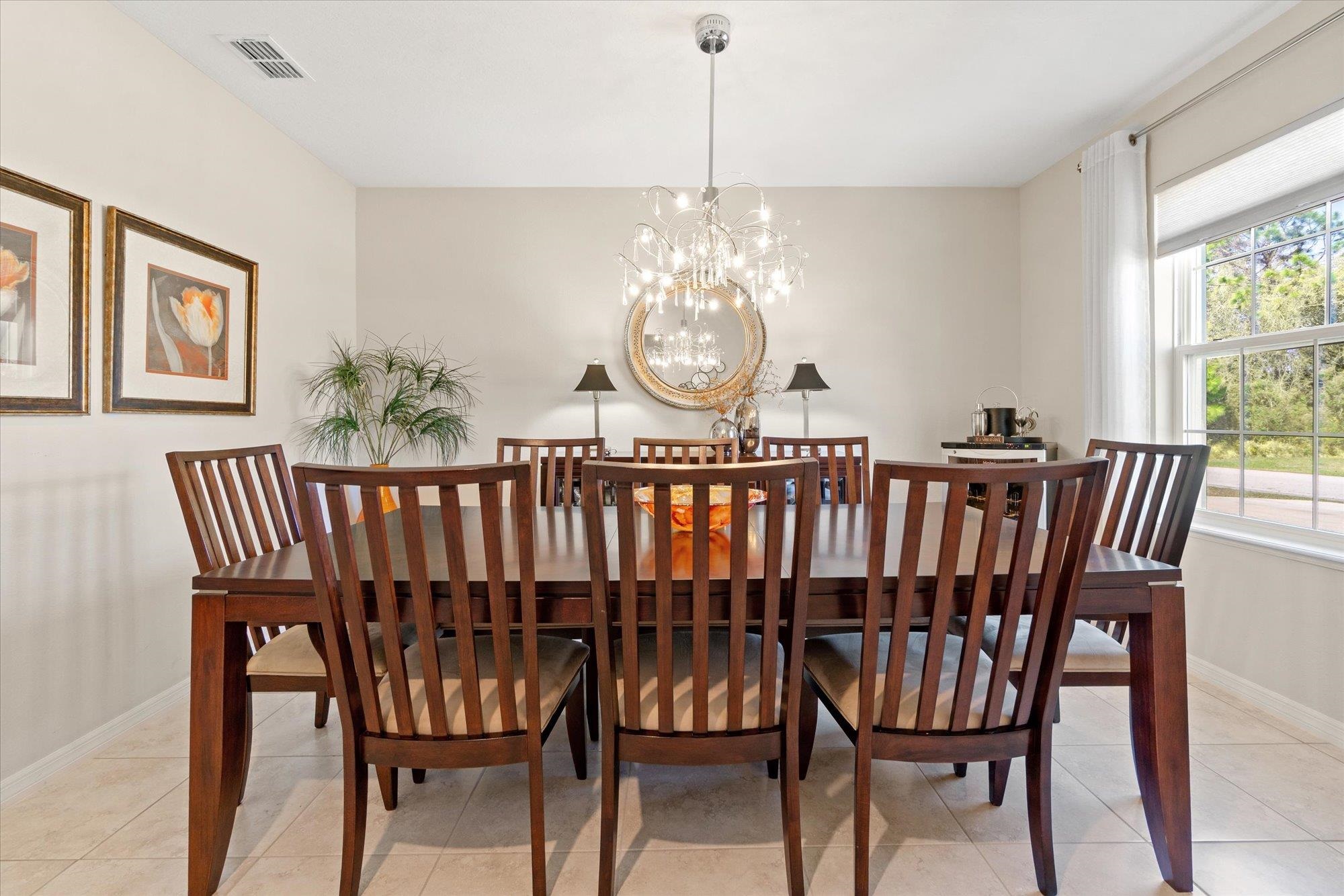 1 Frenora Lane Palm Coast, FL 32137 - Photo 4 of 43 Dining room featuring hanging lights and light tile patterned floors