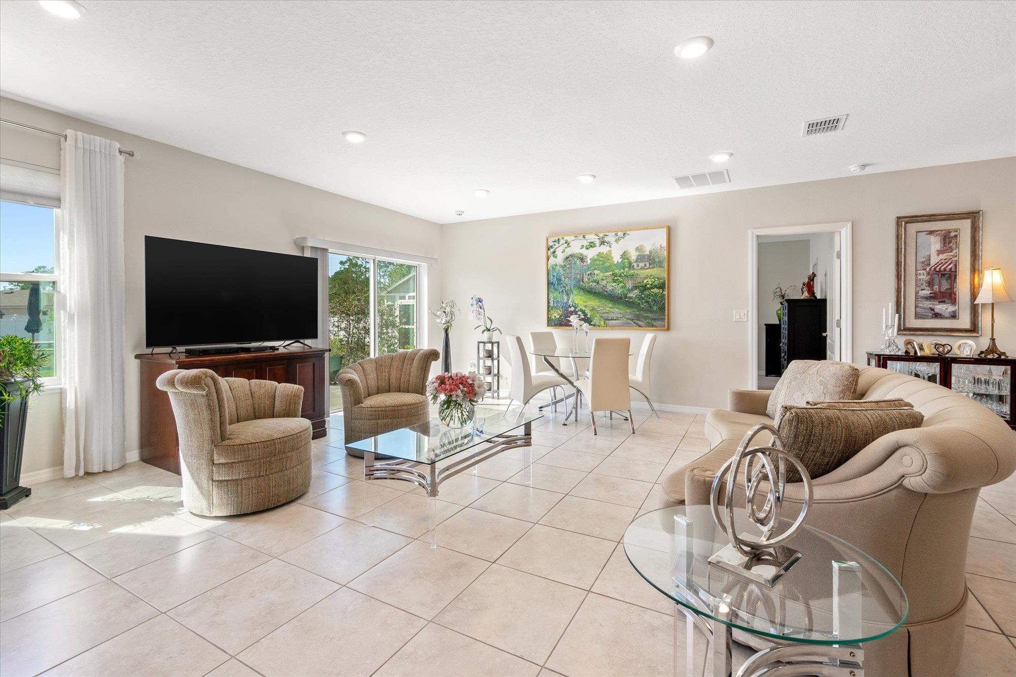 1 Frenora Lane Palm Coast, FL 32137 - Photo 9 of 43 Living room featuring light tile patterned floors and recessed lighting