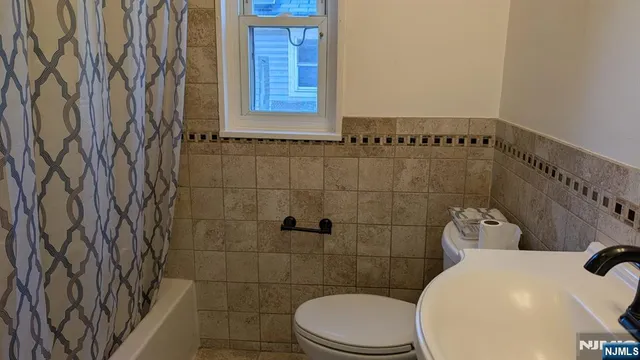 a bathroom with a toilet and sink