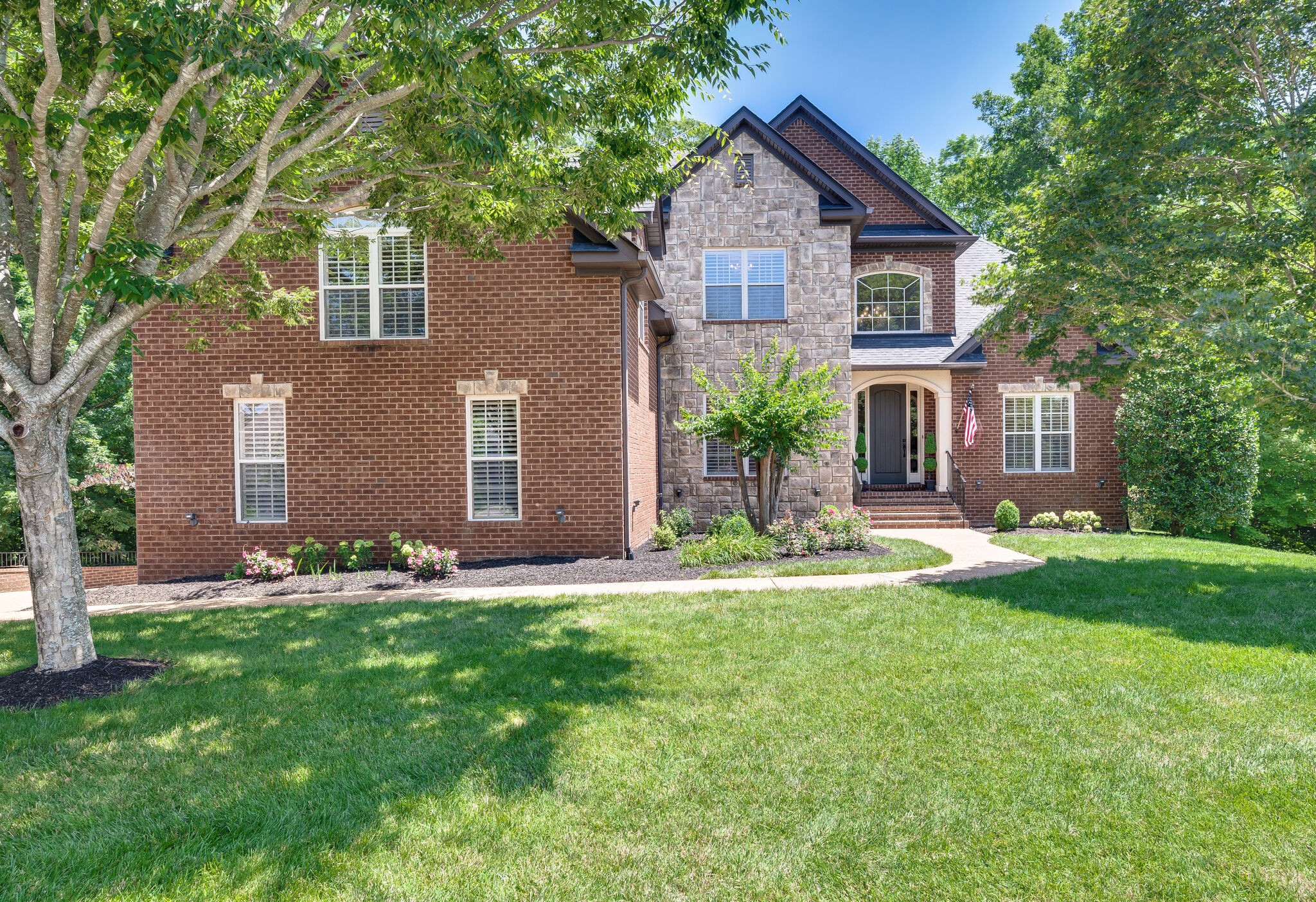 1034 Walnut Bend Lane Brentwood, TN 37027 - Photo 1 of 70 a front view of house with yard and green space
