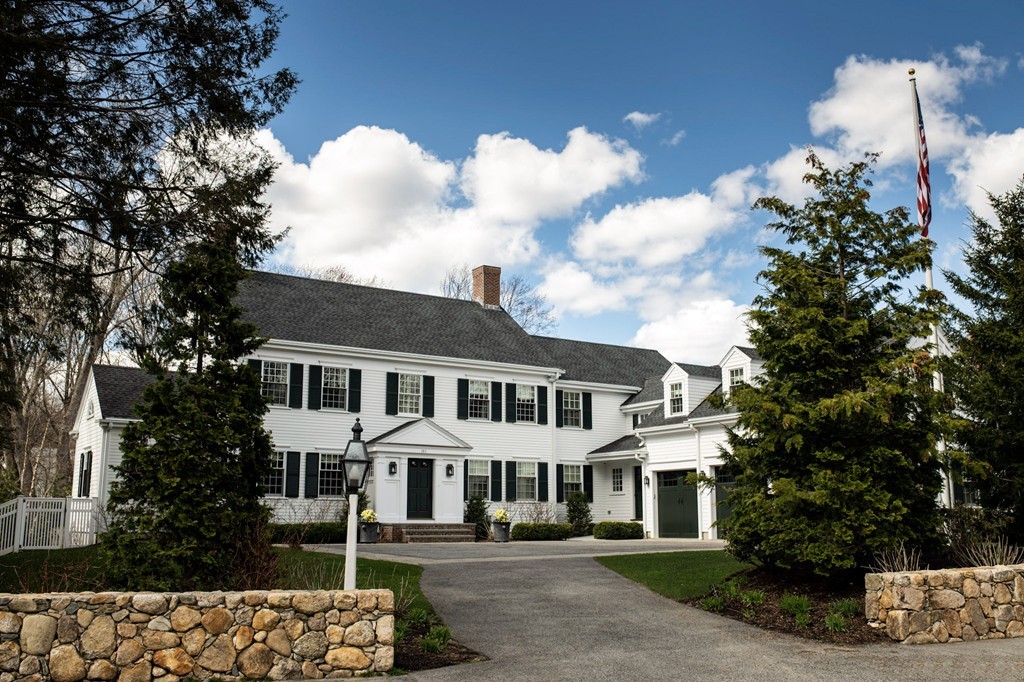 183 Lowell Road Wellesley, MA 02481 - Photo 1 of 27 a front view of a house with a garden