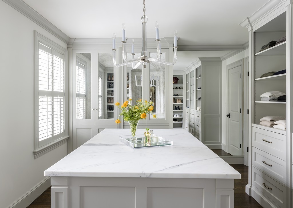 183 Lowell Road Wellesley, MA 02481 - Photo 17 of 27 a kitchen with a white center island and a chandelier