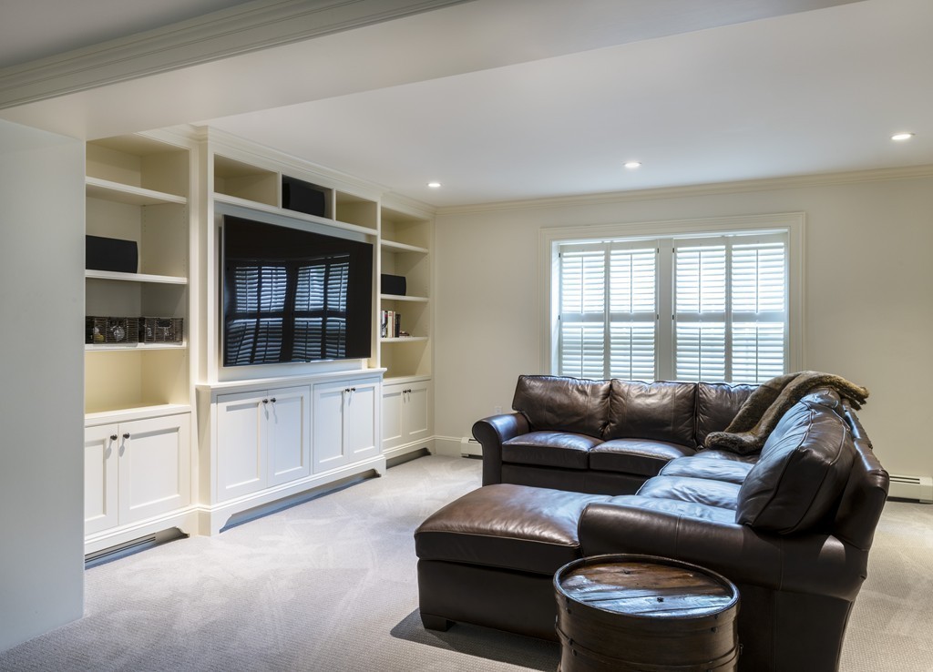 183 Lowell Road Wellesley, MA 02481 - Photo 24 of 27 a living room with furniture and a flat screen tv