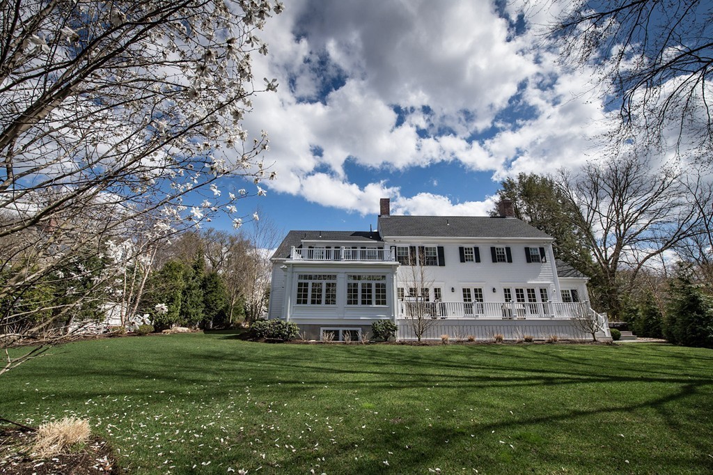 183 Lowell Road Wellesley, MA 02481 - Photo 27 of 27 a front view of a house with a garden