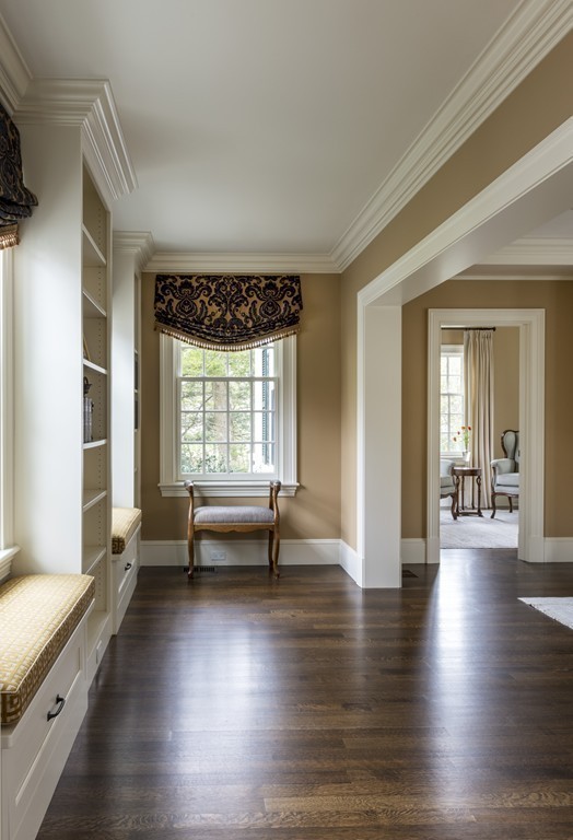183 Lowell Road Wellesley, MA 02481 - Photo 6 of 27 a view of an entryway with wooden floor and a window