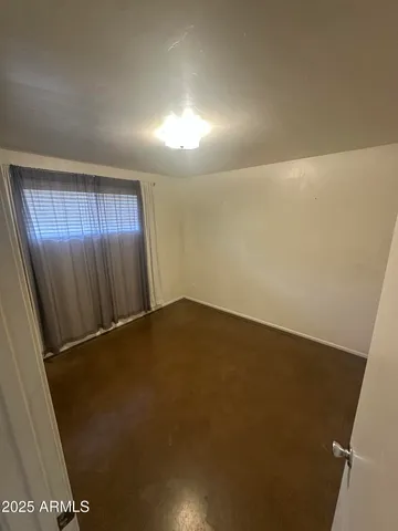 an empty room with closet area