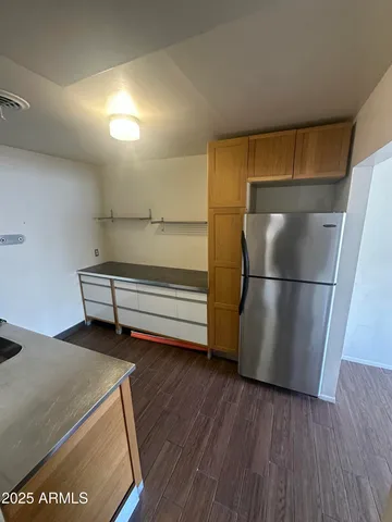 a kitchen with a sink and a refrigerator