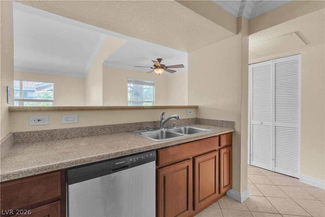8101 West Flamingo Road, Unit 2001 Las Vegas, NV 89147 - Photo 21 of 28 A well-appointed kitchen offers ample counter space and an integrated dishwasher for effortless meal prep.