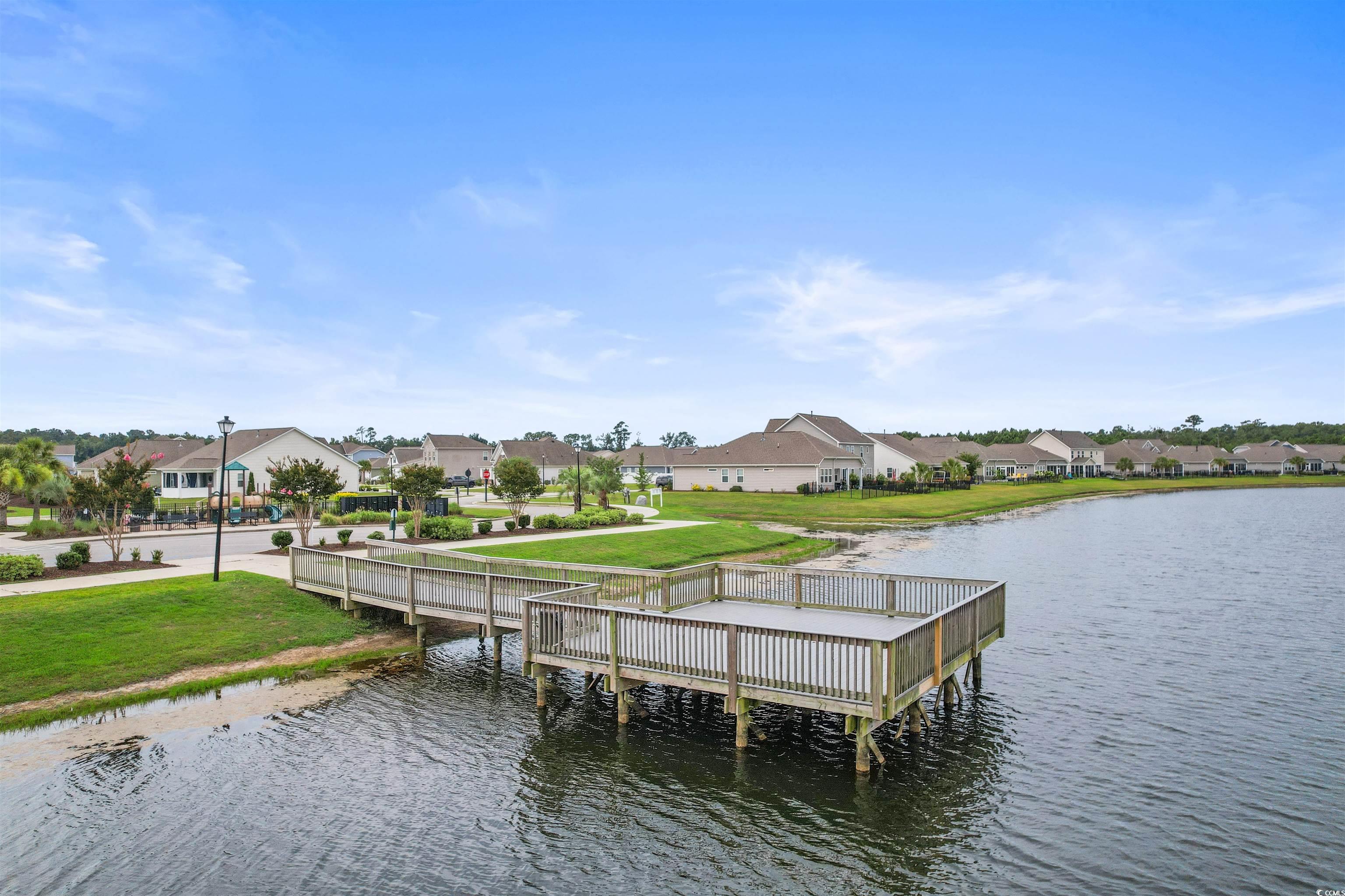 4842 Timberlake Drive Myrtle Beach, SC 29588 - Photo 37 of 38 Dock area featuring a residential view, a yard, and a water view