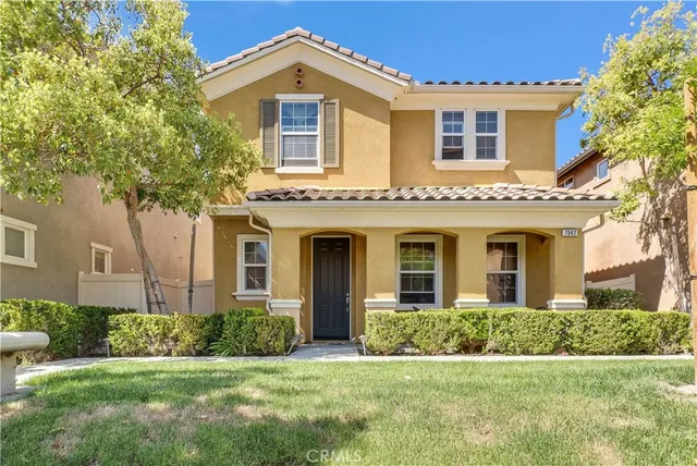 front view of a house with a yard