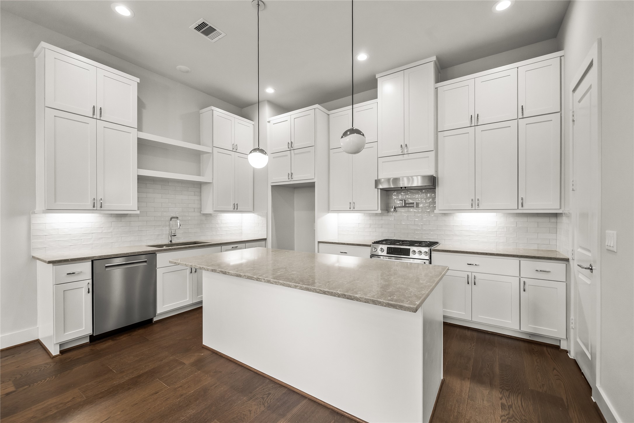 1705 Bologna Lane Houston, TX 77055 - Photo 2 of 43 a kitchen with stainless steel appliances granite countertop a sink a stove and a refrigerator