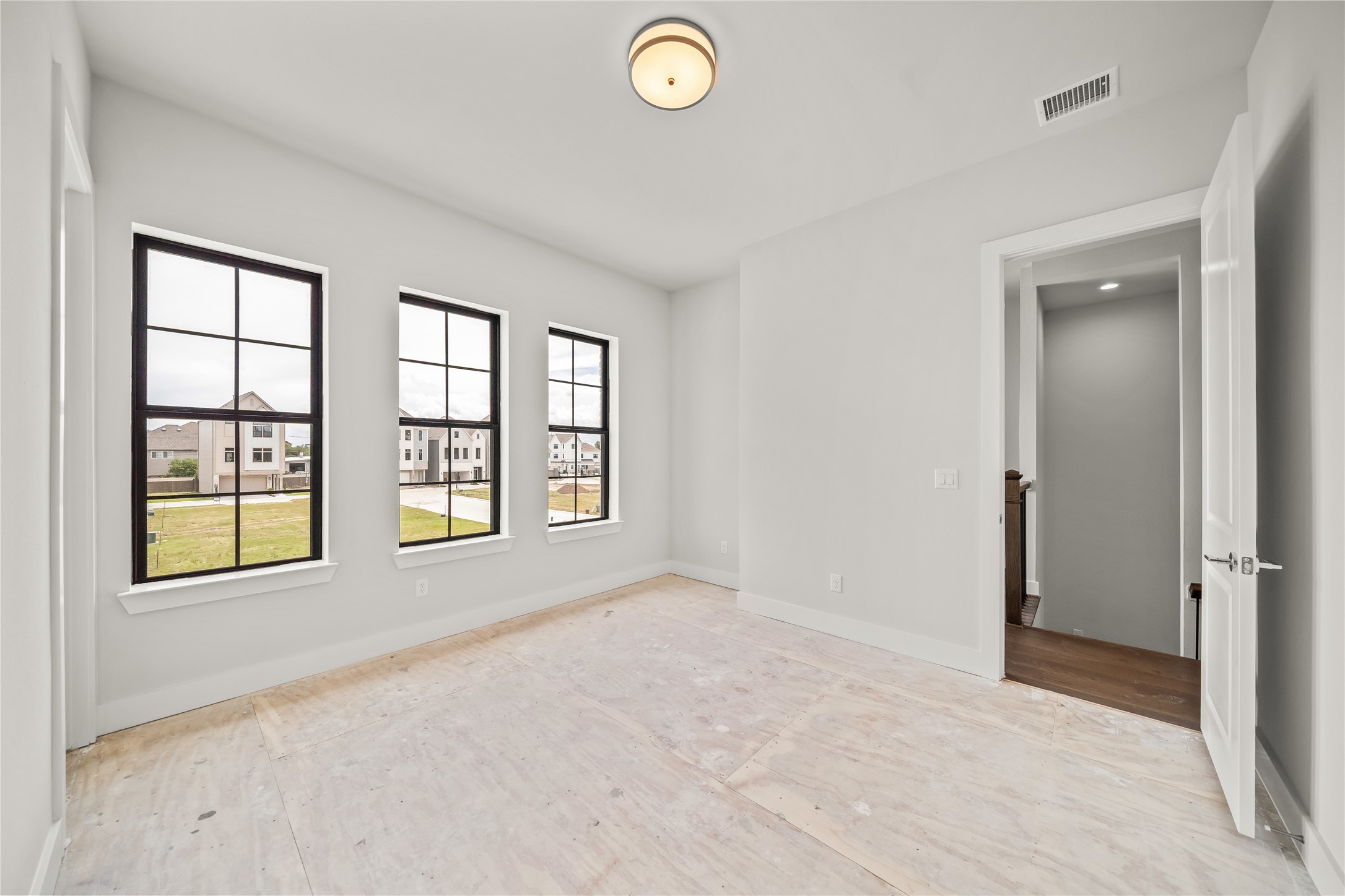 1705 Bologna Lane Houston, TX 77055 - Photo 23 of 43 an empty room with windows and closet