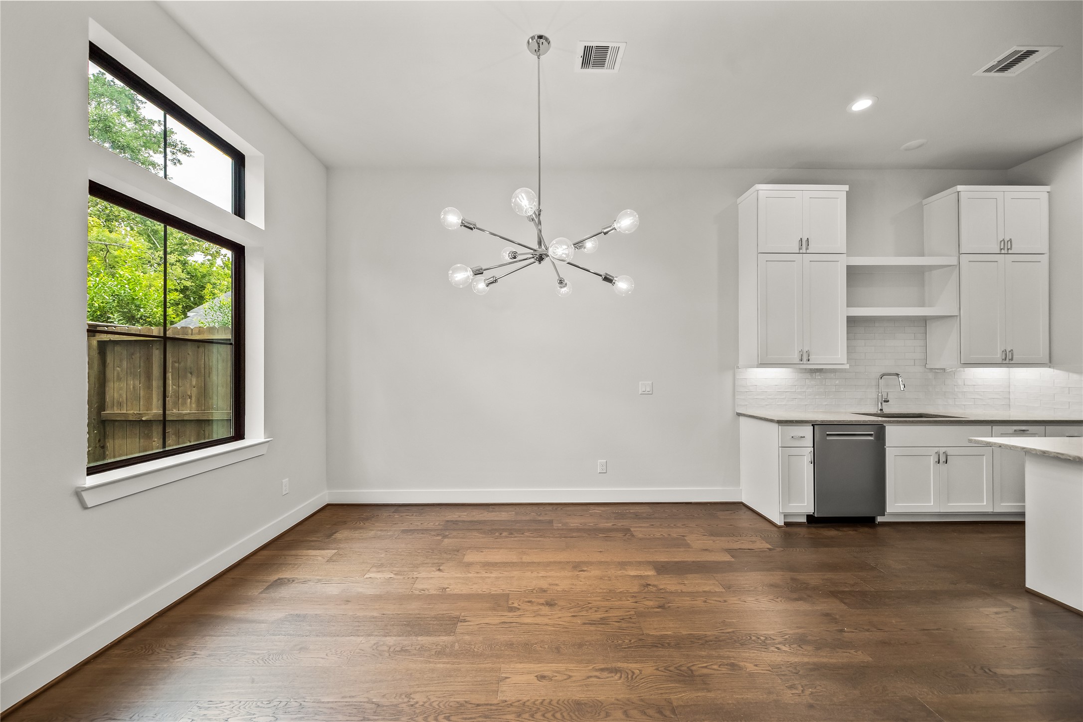 1705 Bologna Lane Houston, TX 77055 - Photo 7 of 43 a kitchen with a stove a sink and a window
