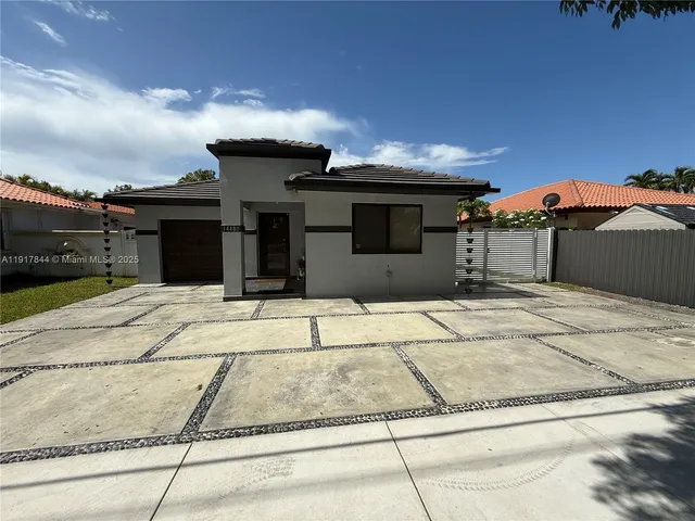 a view of a house with a garage