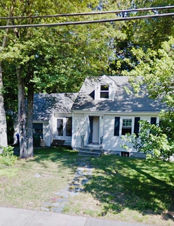 52 Elinor Road Newton, MA 02461 - Photo 2 of 5 front view of a house with a yard