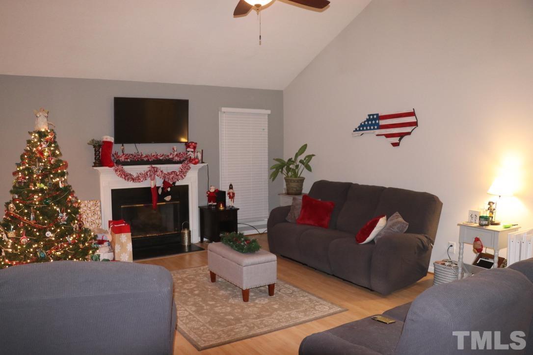 8205 Bellingham Circle Raleigh, NC 27615 - Photo 5 of 16 a living room with furniture and a flat screen tv