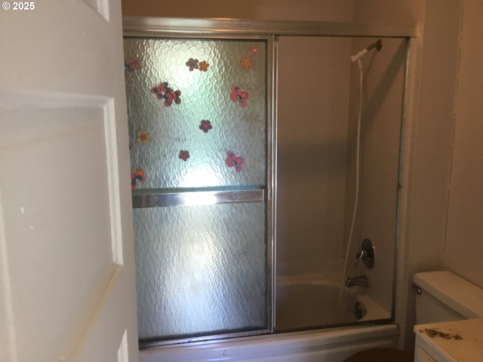 2517 Liberty Street North Bend, OR 97459 - Photo 12 of 42 a bathroom with a glass shower door