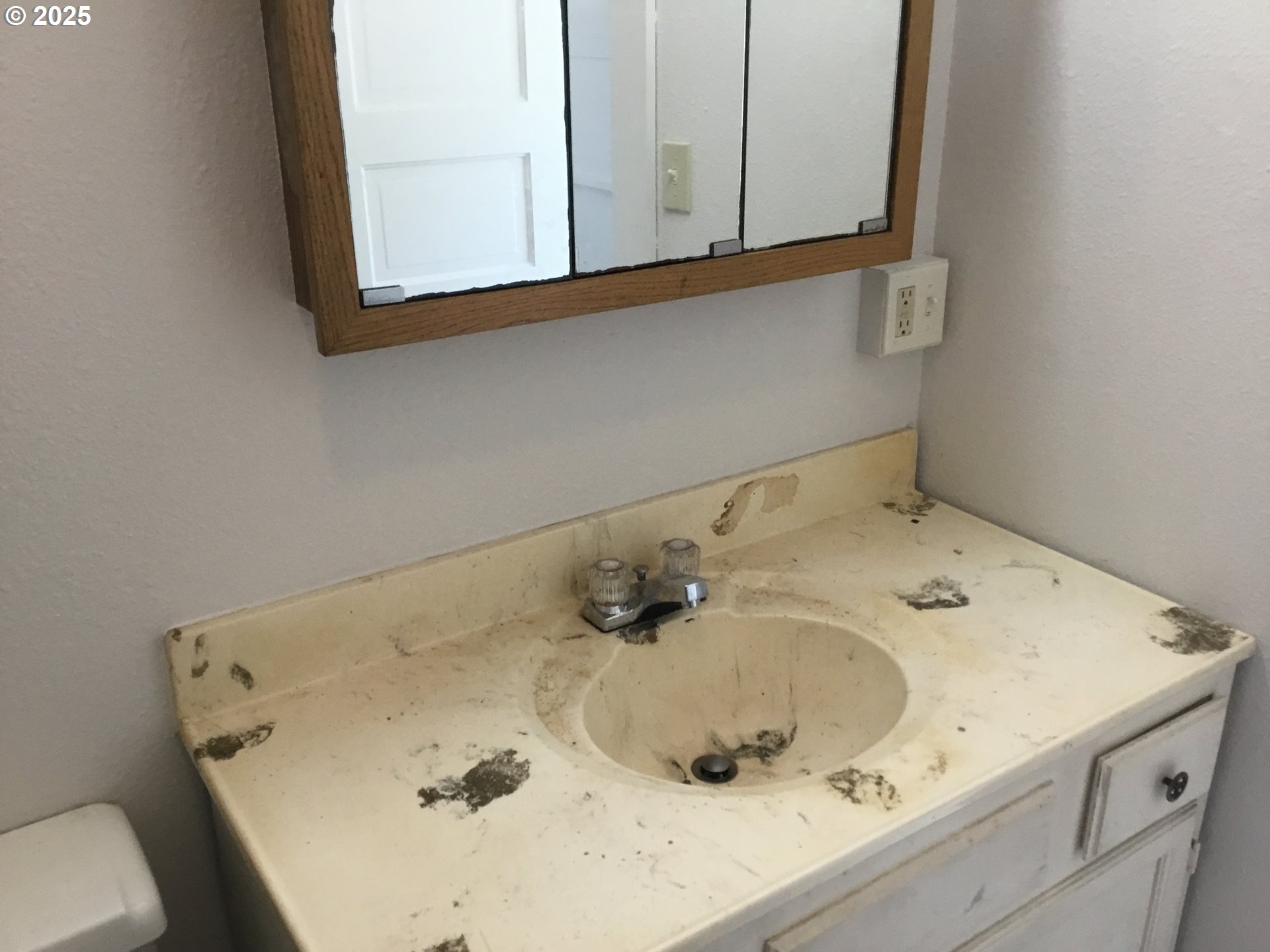 2517 Liberty Street North Bend, OR 97459 - Photo 13 of 42 a bathroom with a sink and a mirror