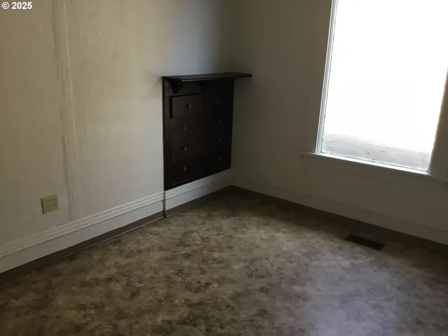 a view of a room that has a window in it