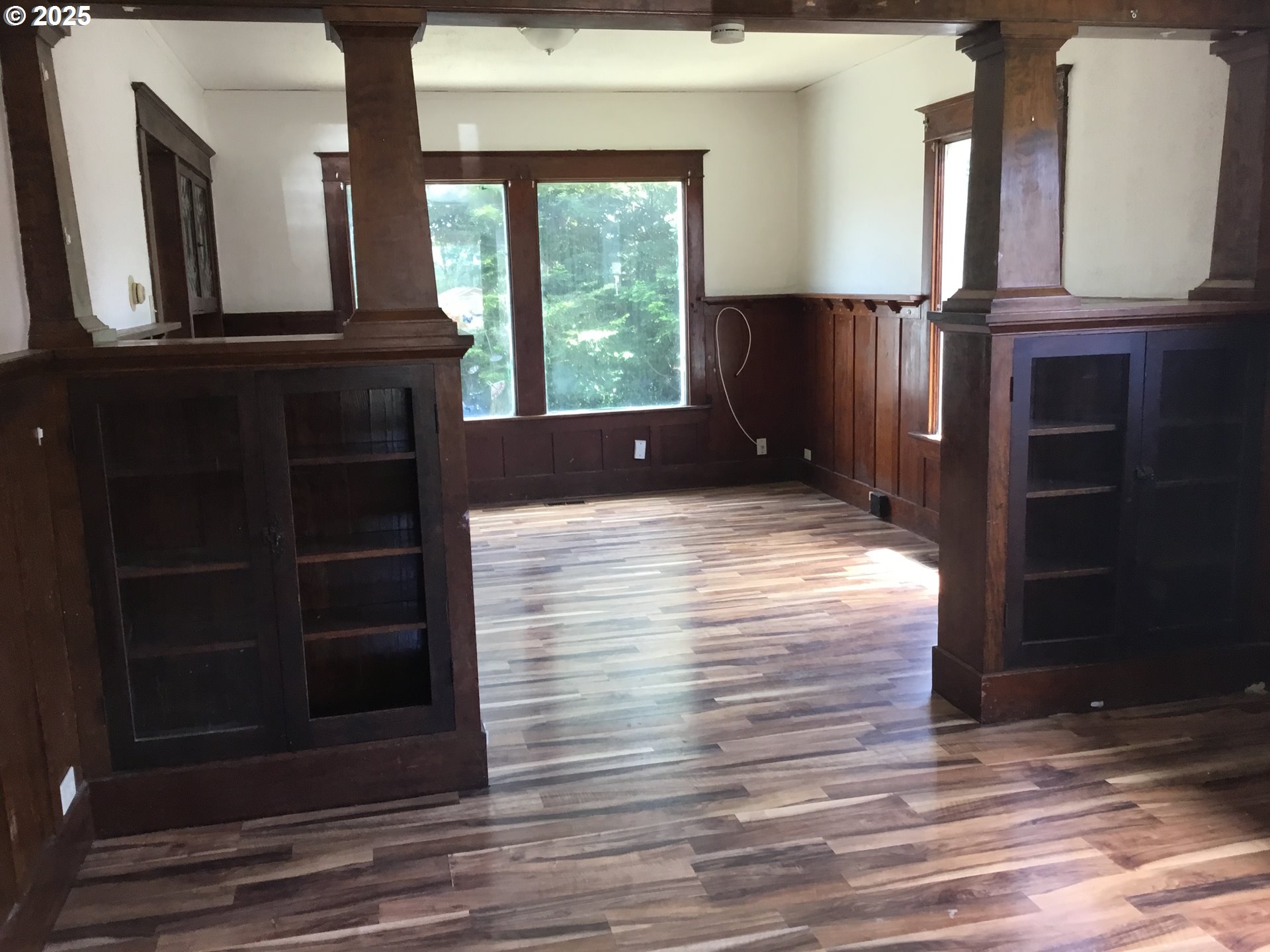 2517 Liberty Street North Bend, OR 97459 - Photo 3 of 42 a view of a living room with wooden floor and a large window