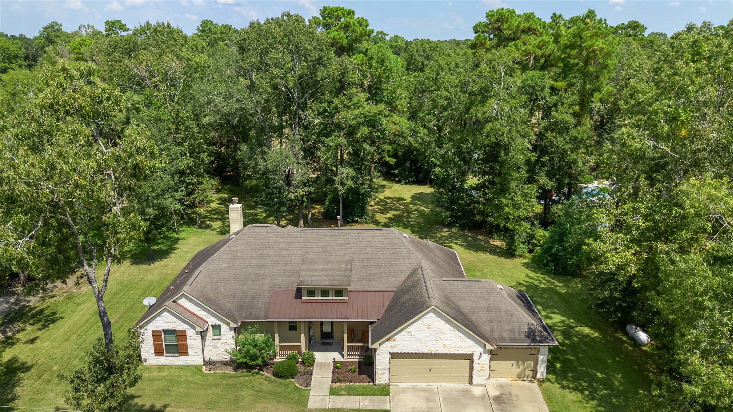 26806 Winding River Trail Huffman, TX 77336 - Photo 32 of 40 front of home showing all wooded areas around home