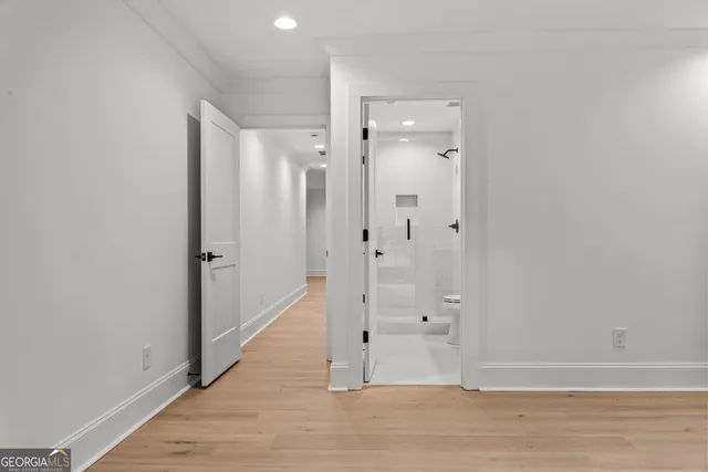 an aerial view of a house with a yard basket ball court and outdoor seating