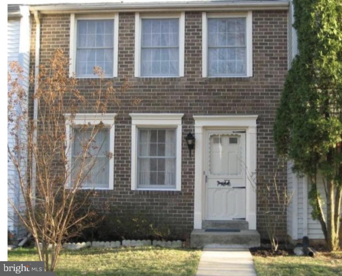 Charming brick facade with inviting entry.