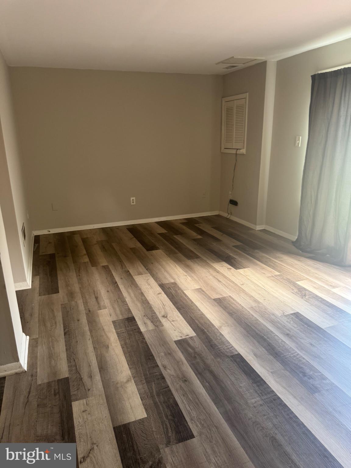 1404 Elm Grove Circle Silver Spring, MD 20905 - Photo 22 of 27 Spacious room with modern flooring.