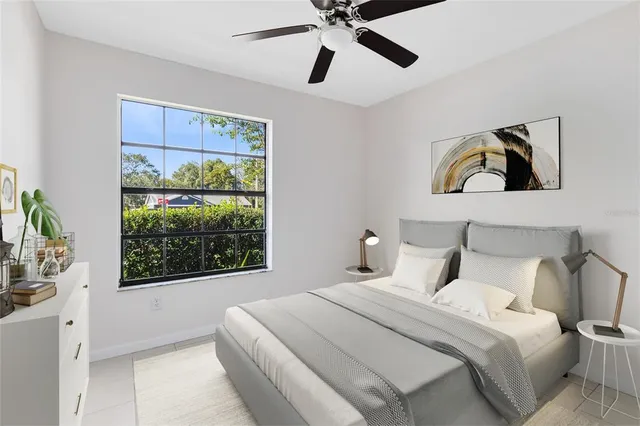 a bedroom with a large bed and a window