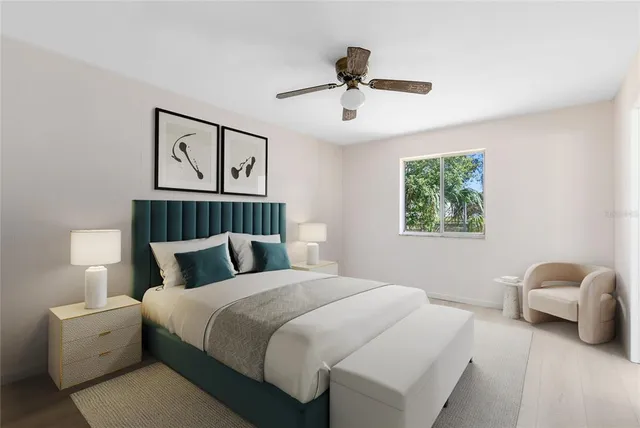 a bedroom with a bed couch and window