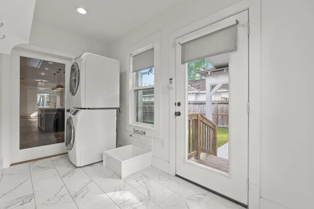 a bathroom with a tub and mirror