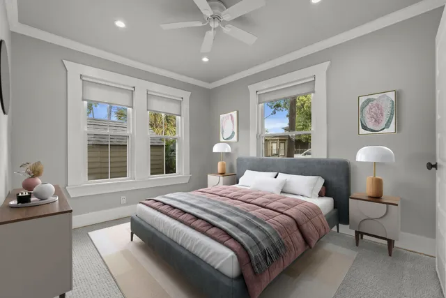 a bedroom with a bed and a window