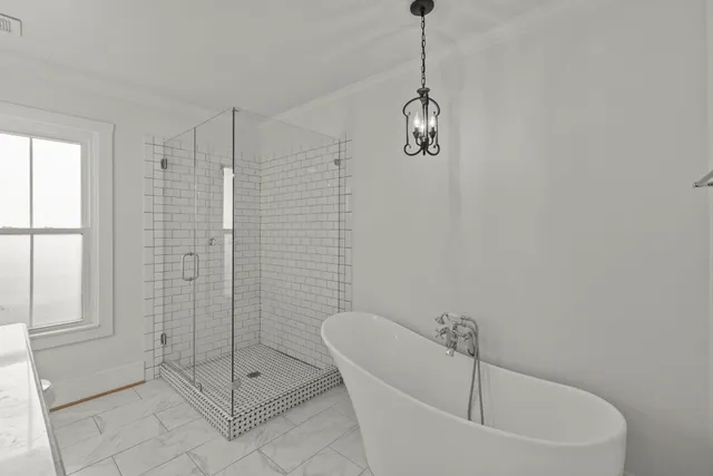 a bathroom with a bathtub and shower