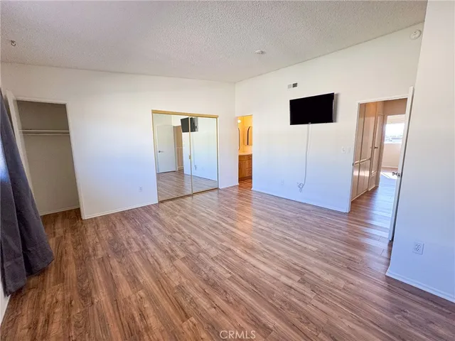a view of a livingroom with wooden floor