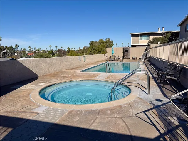 a view of a swimming pool with a lounge chair