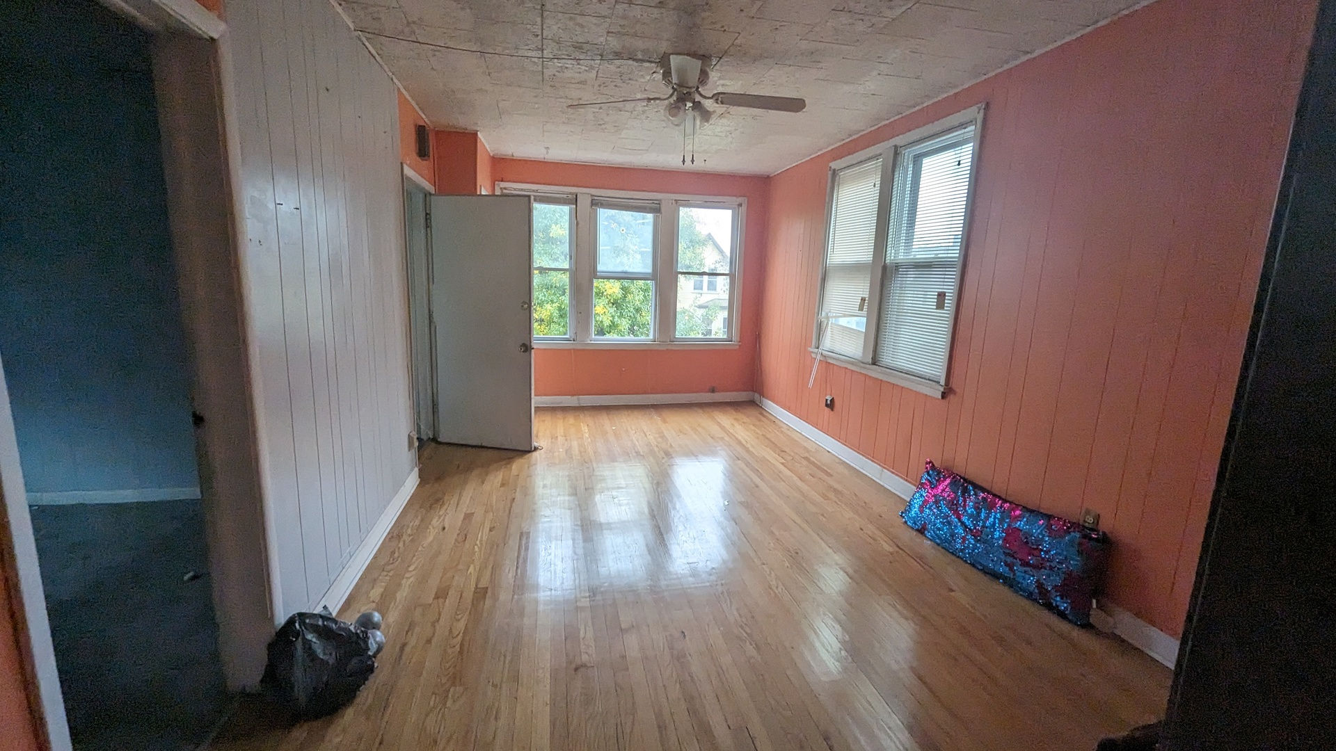 3922 North Bernard Street Chicago, IL 60618 - Photo 3 of 9 wooden floor in an empty room with a window