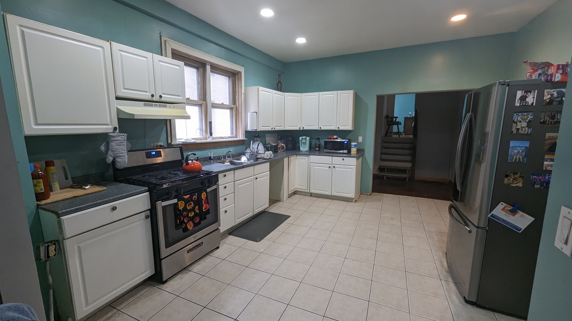 3922 North Bernard Street Chicago, IL 60618 - Photo 4 of 9 a kitchen with stainless steel appliances granite countertop a refrigerator sink and stove