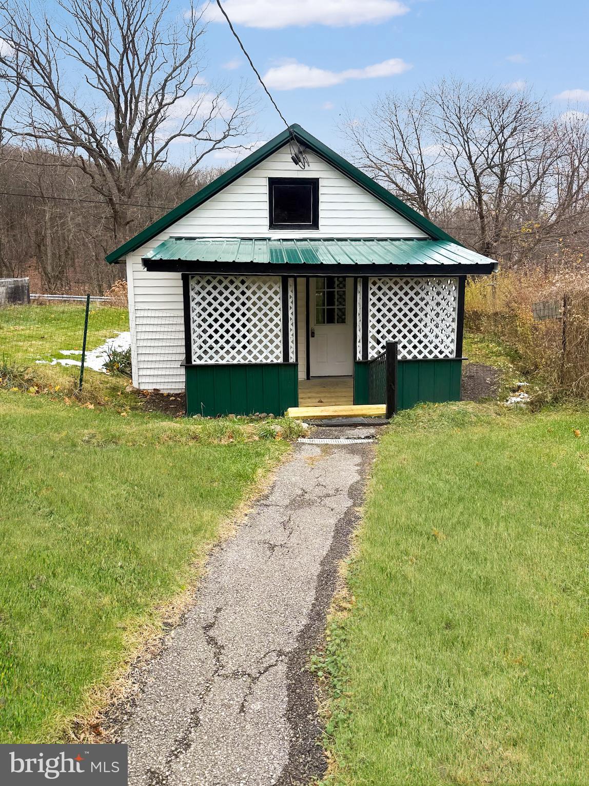 638 State Street Philipsburg, PA 16866 - Photo 10 of 11 a front view of a house with a yard and garage