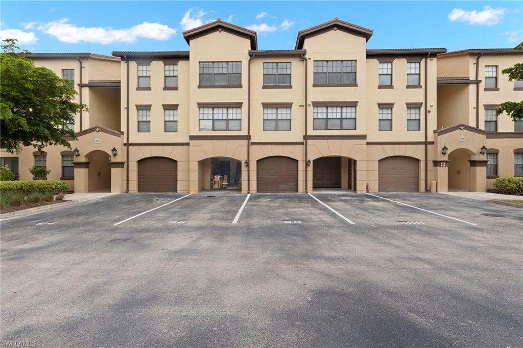 a front view of a residential apartment building with a yard