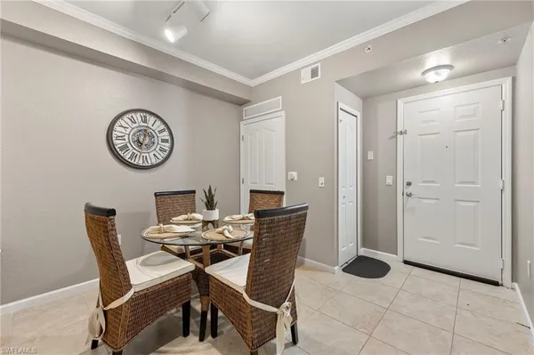 a view of a room with furniture and a table